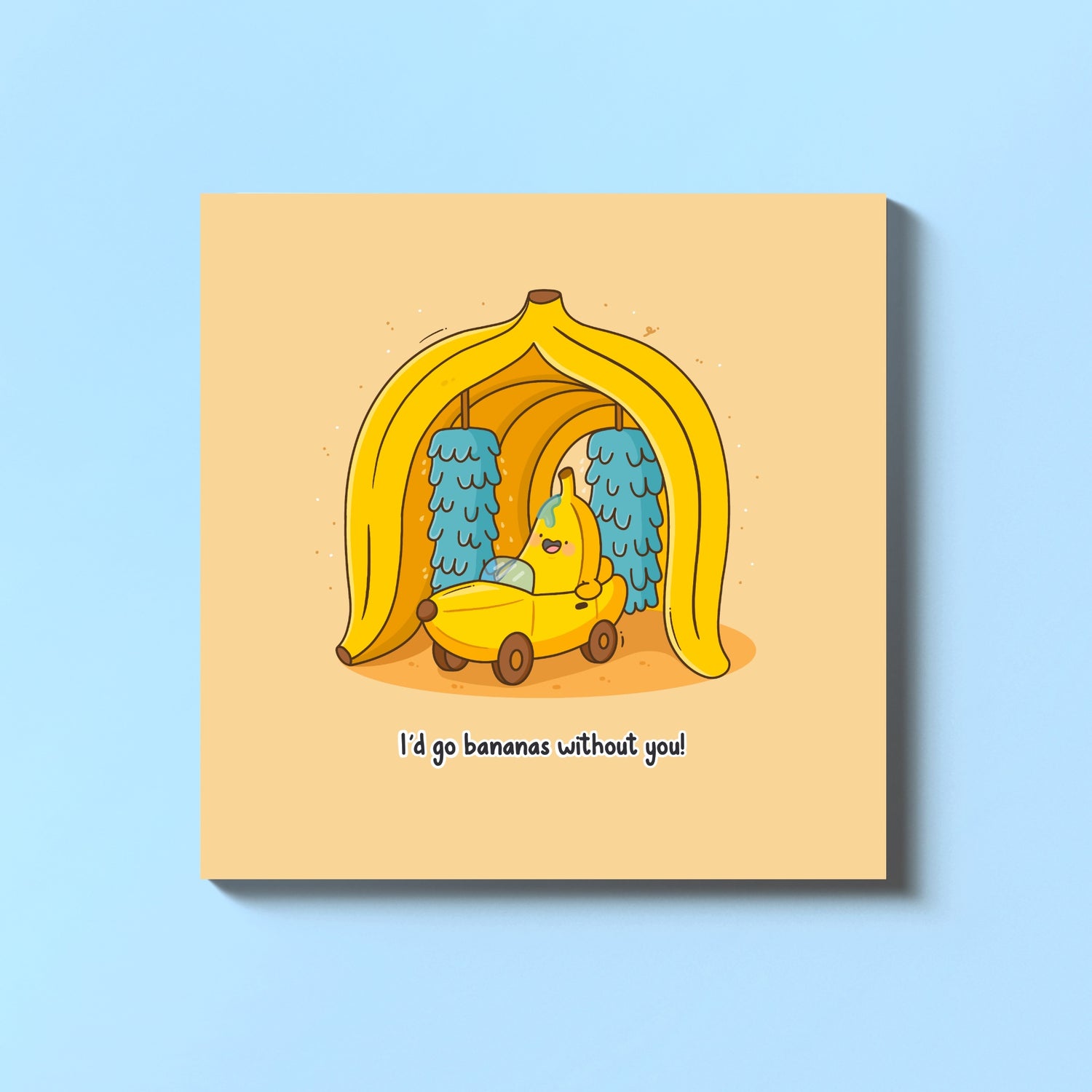 Banana in banana car wash greeting card on blue table