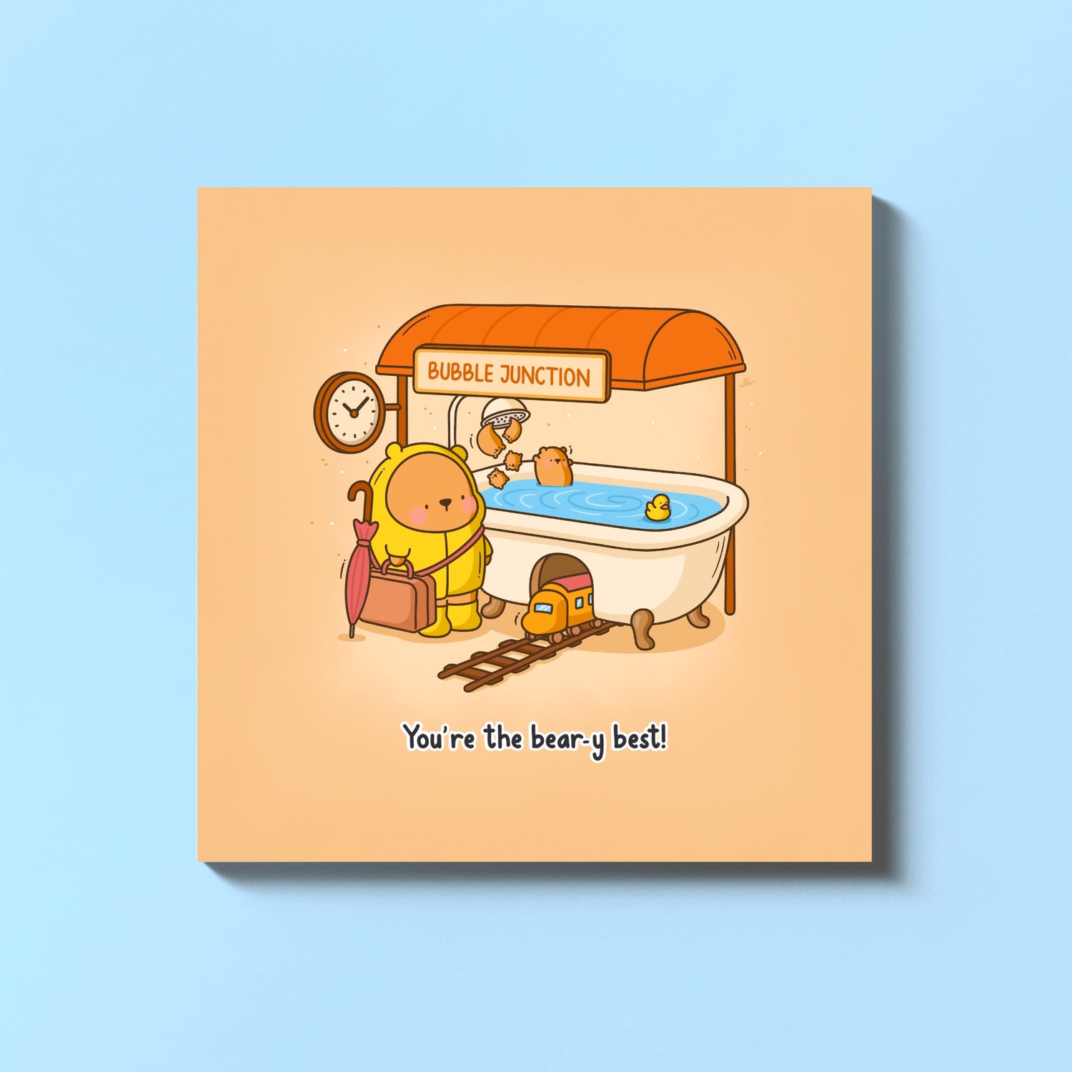 Cute illustrated bear bath card with train and tub by Toastedink on blue table