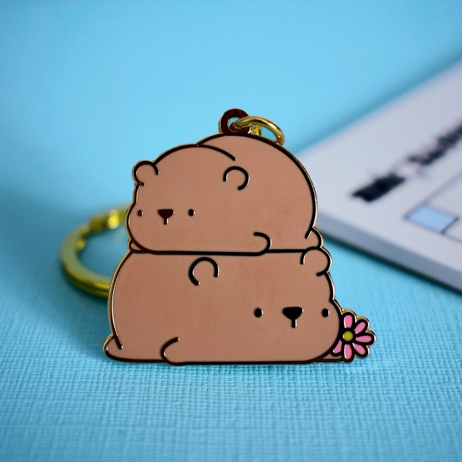 Bear keyring on blue table