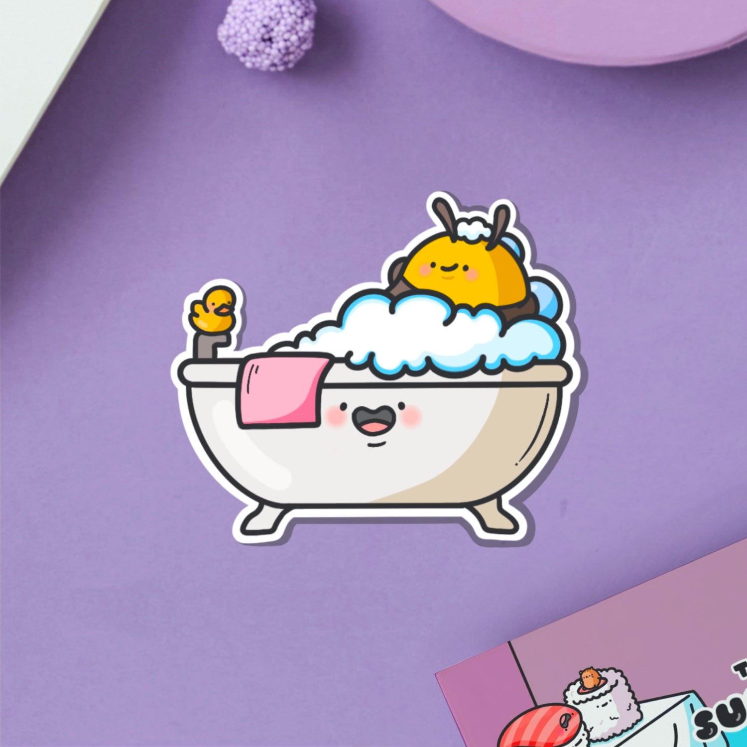 Bee in a bathtub vinyl sticker on purple table