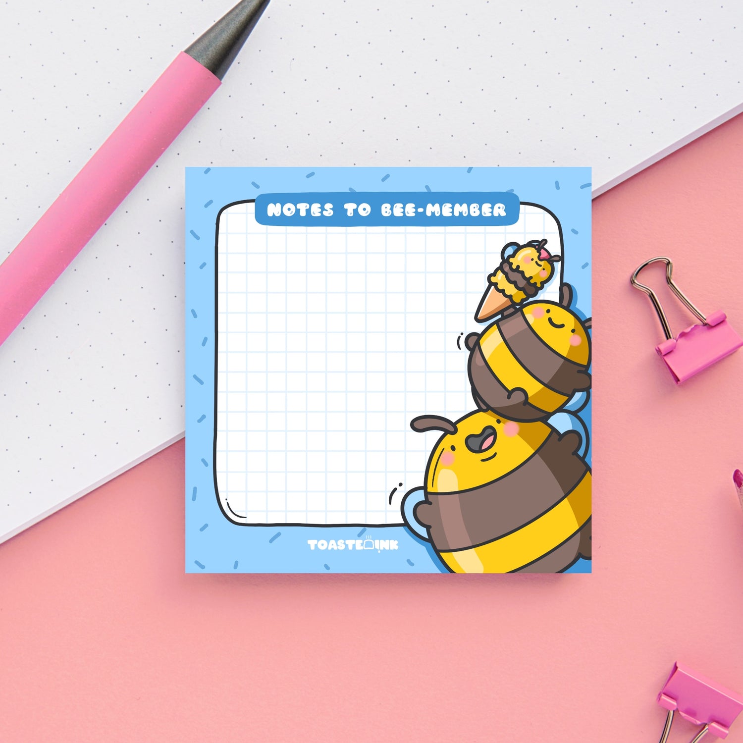 Bee sticky Notes on pink table