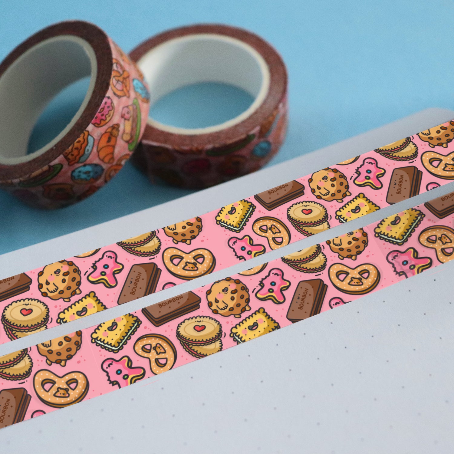 Pink biscuit washi tape with 2 rolls of washi tape and blue table