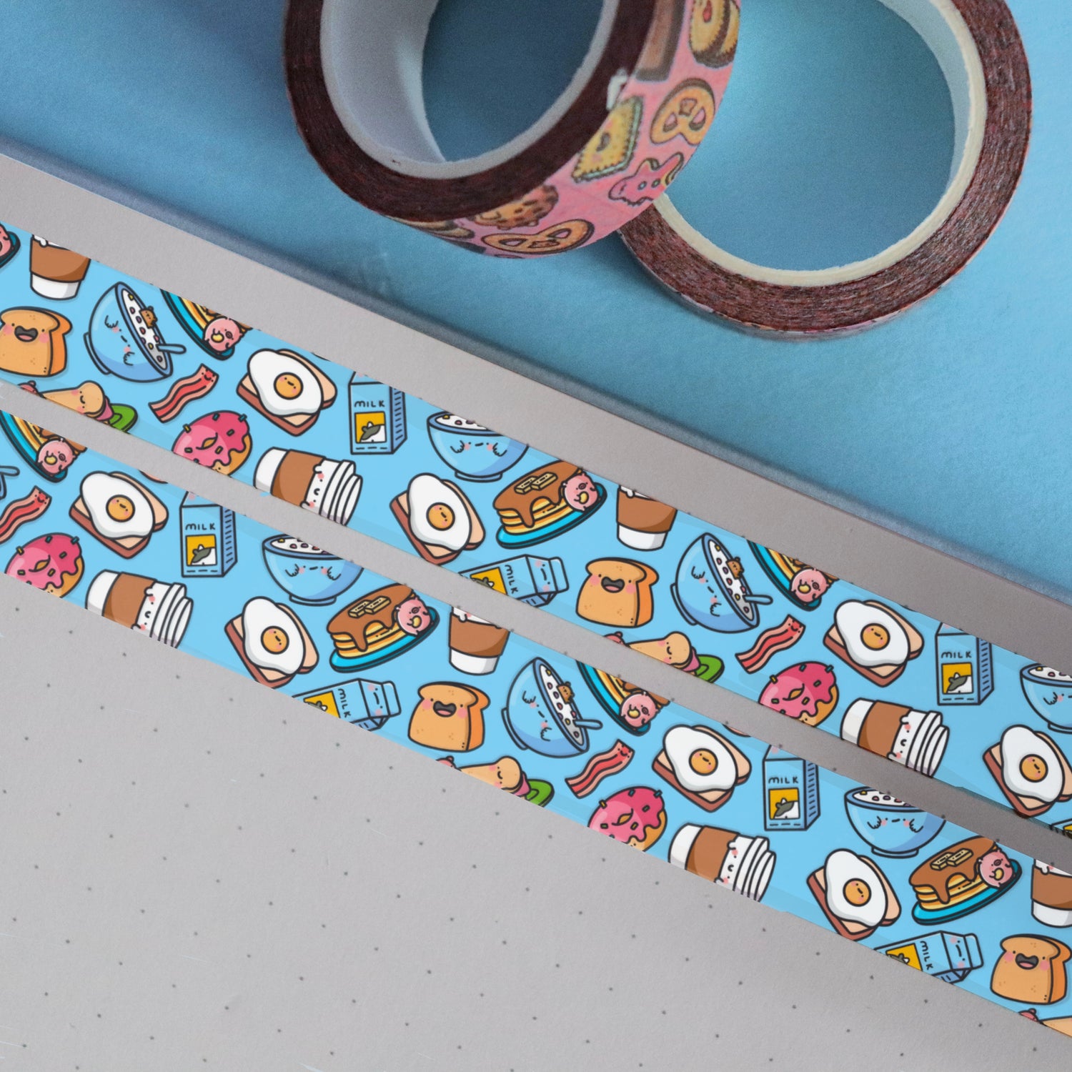 Blue breakfast washi tape on blue table with 2 rolls of washi tape