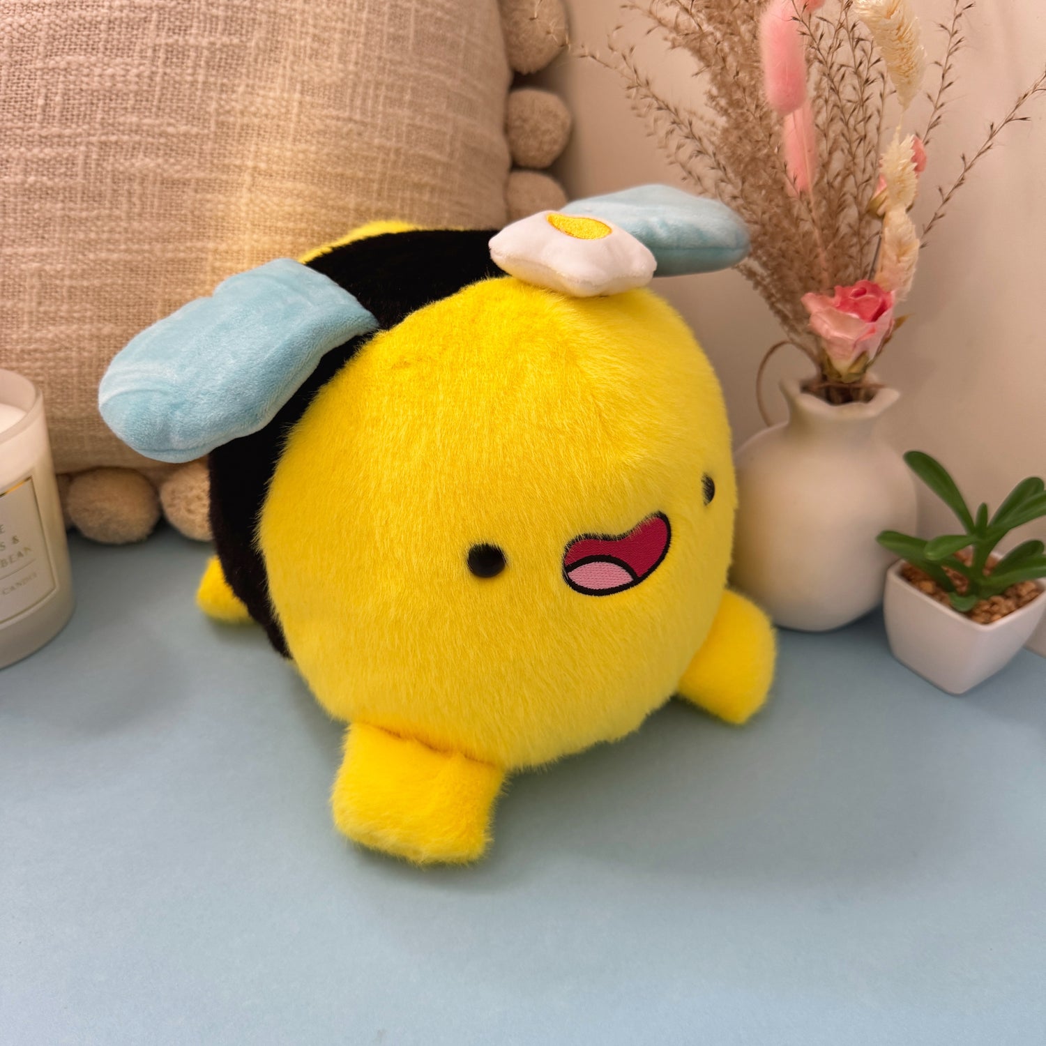 Bumblebee plush on blue table