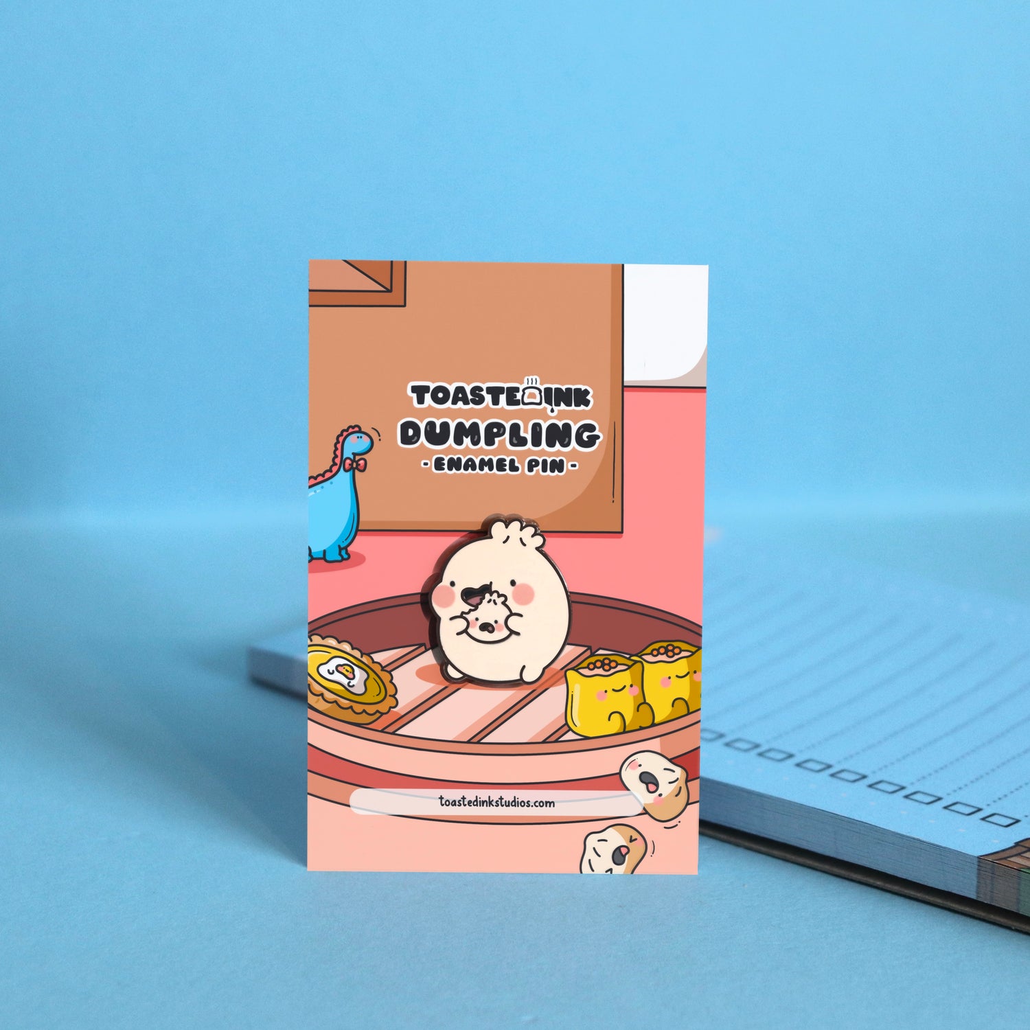 Dumpling eating enamel pin on dim sum boat backing card