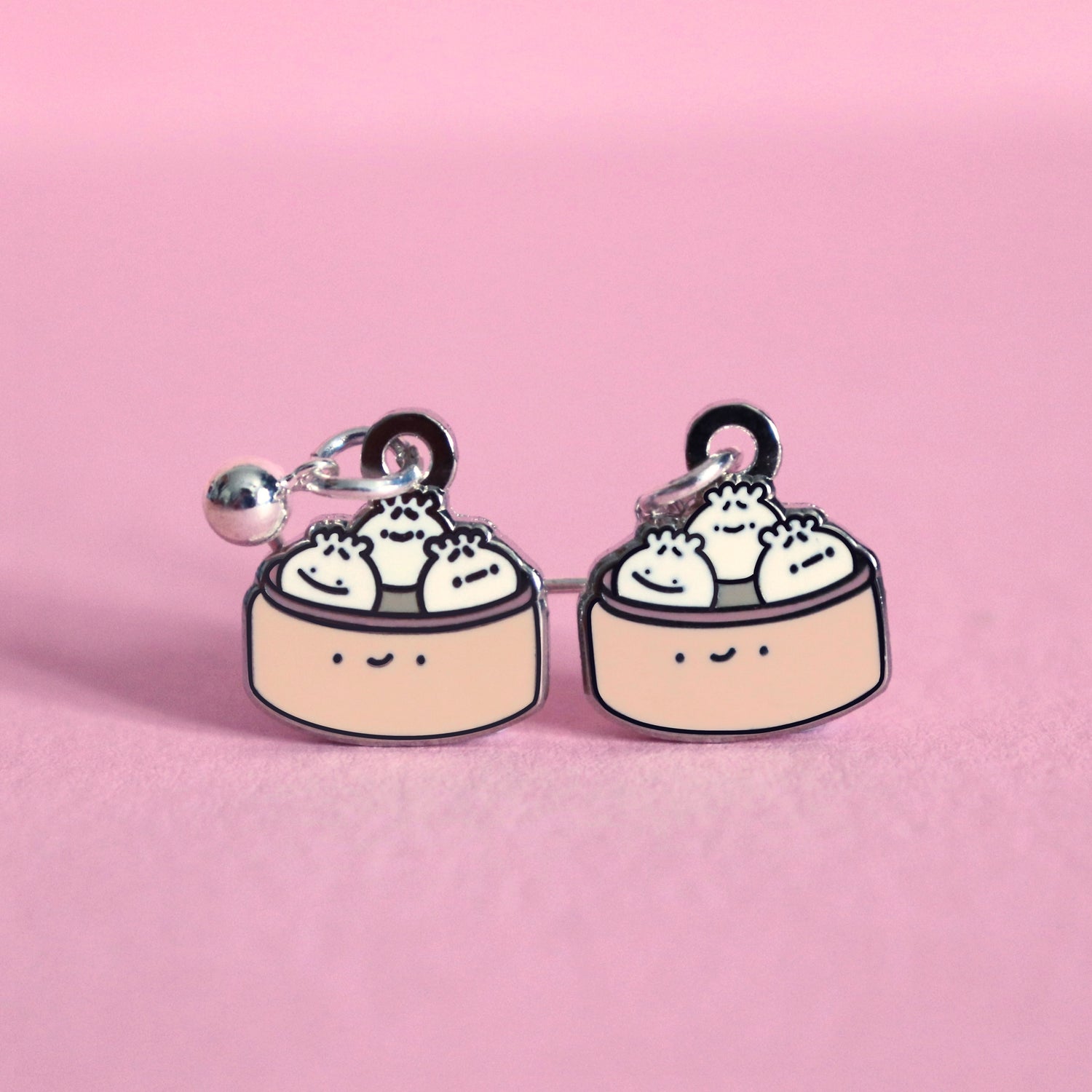 Dumpling earrings on pink table