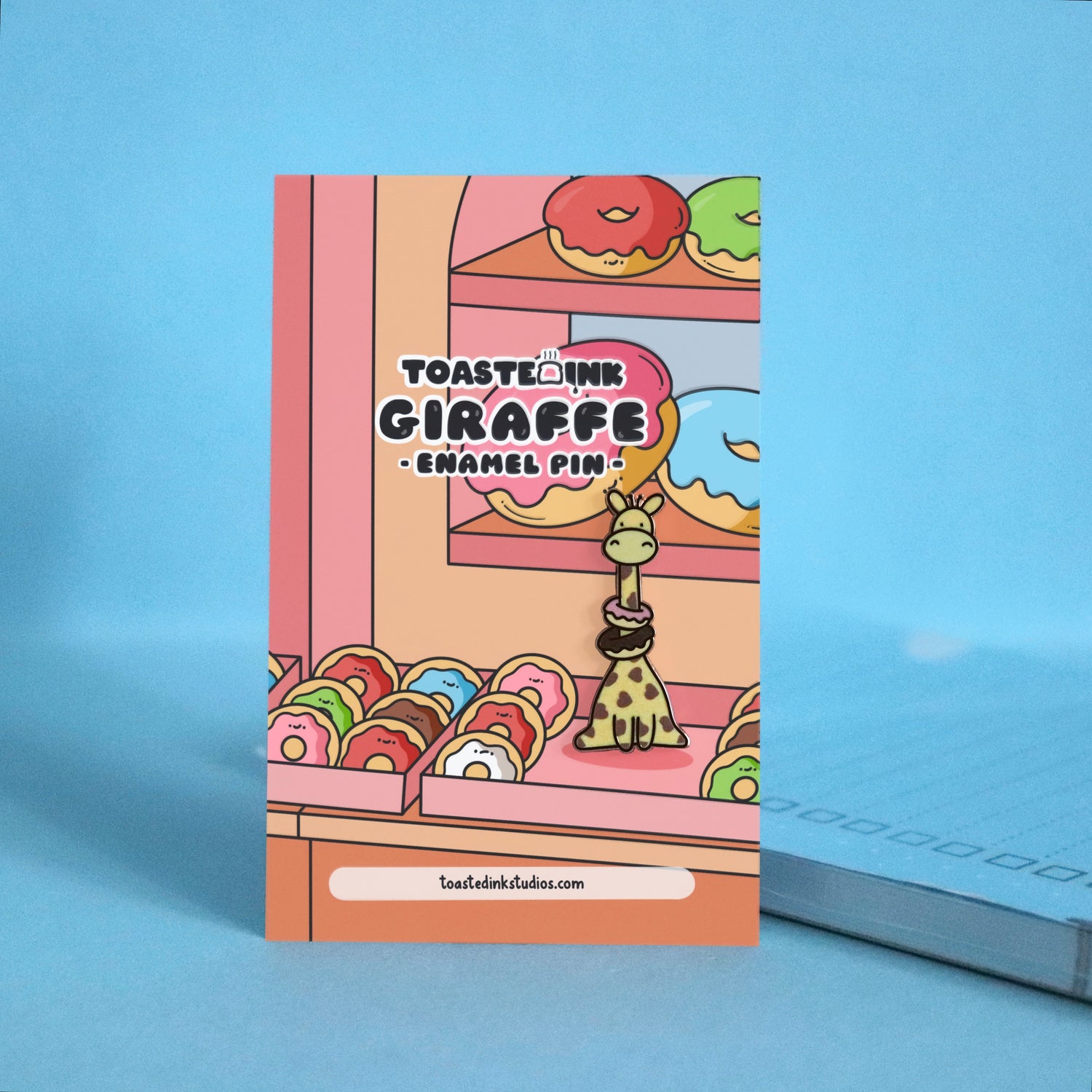 Giraffe with heart prints wearing donuts enamel pin on donuts backing card