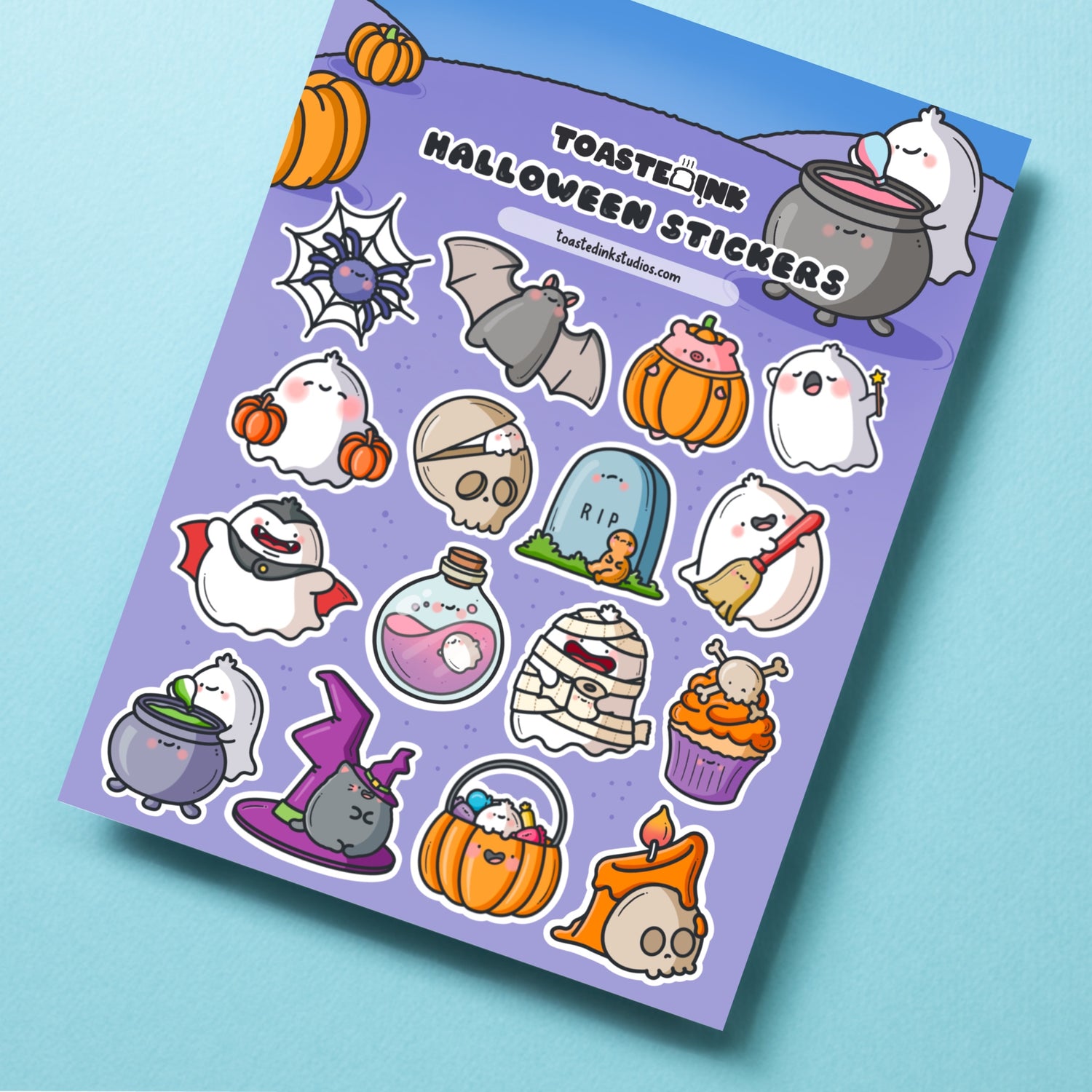 Halloween stickers on blue table close up