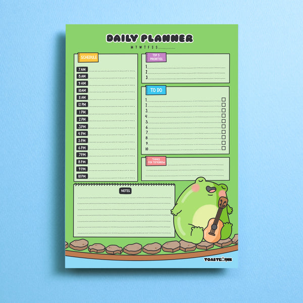 Frog A5 daily planner on blue background