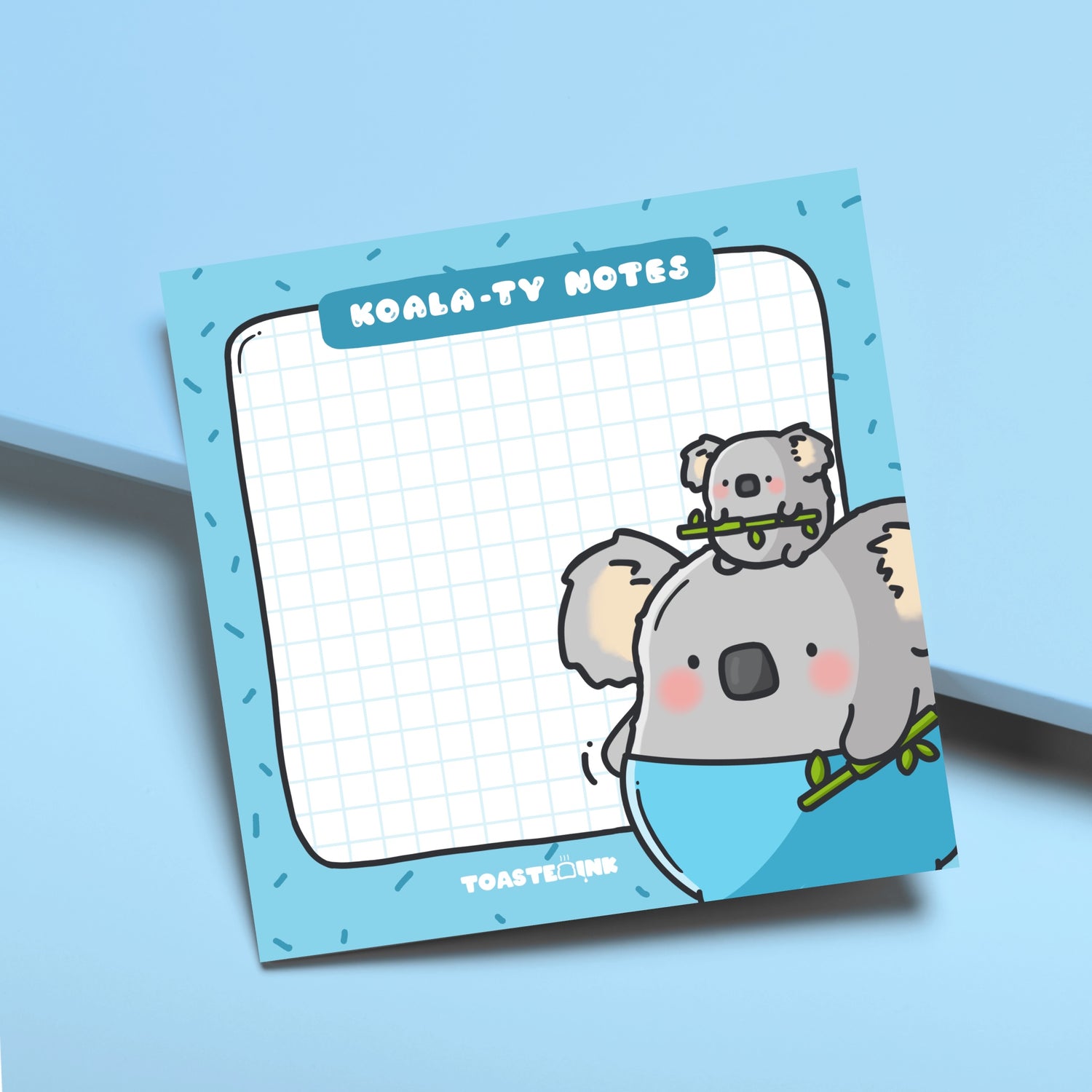 Koala sticky notes on blue desk