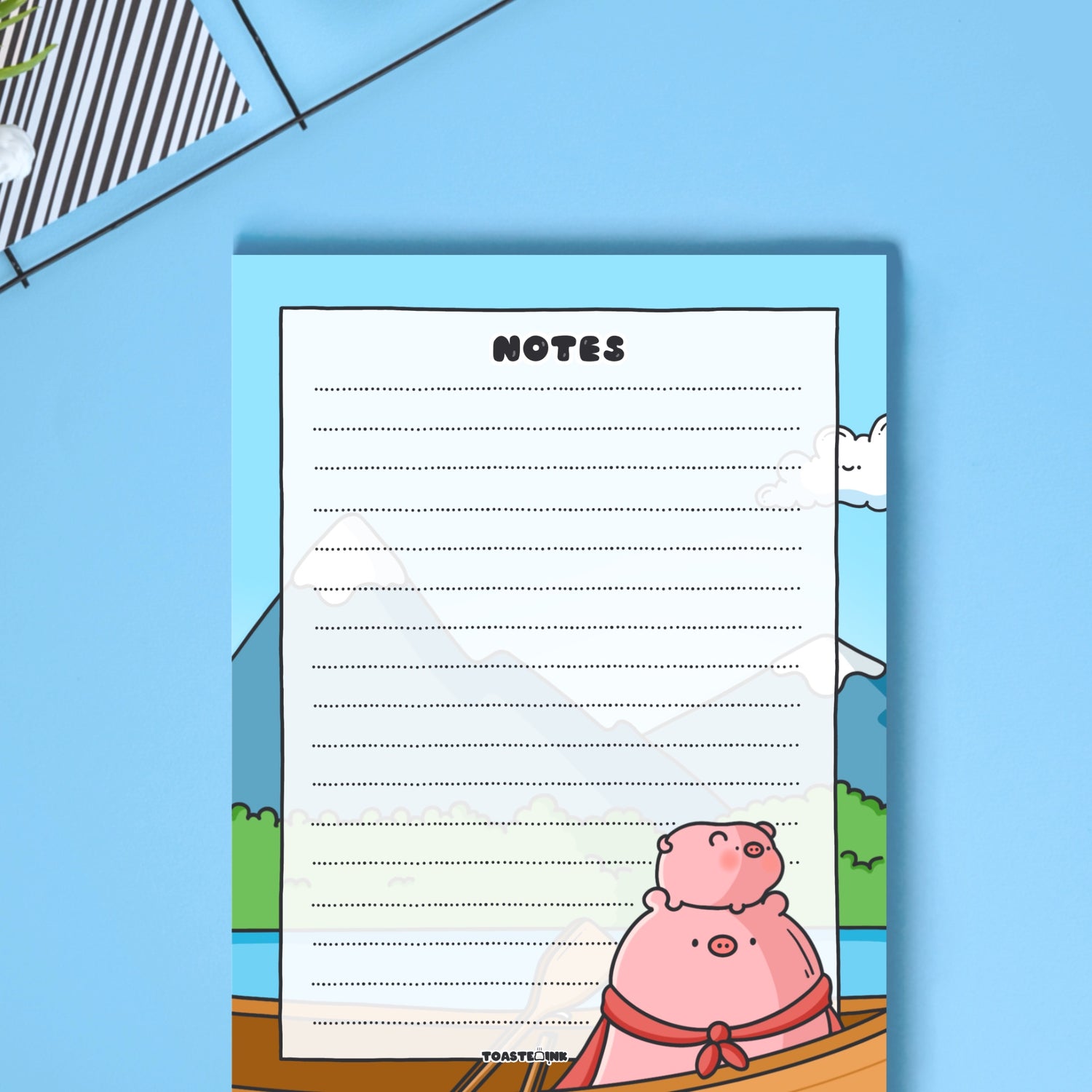 A6 Pig Notepad on blue table close up