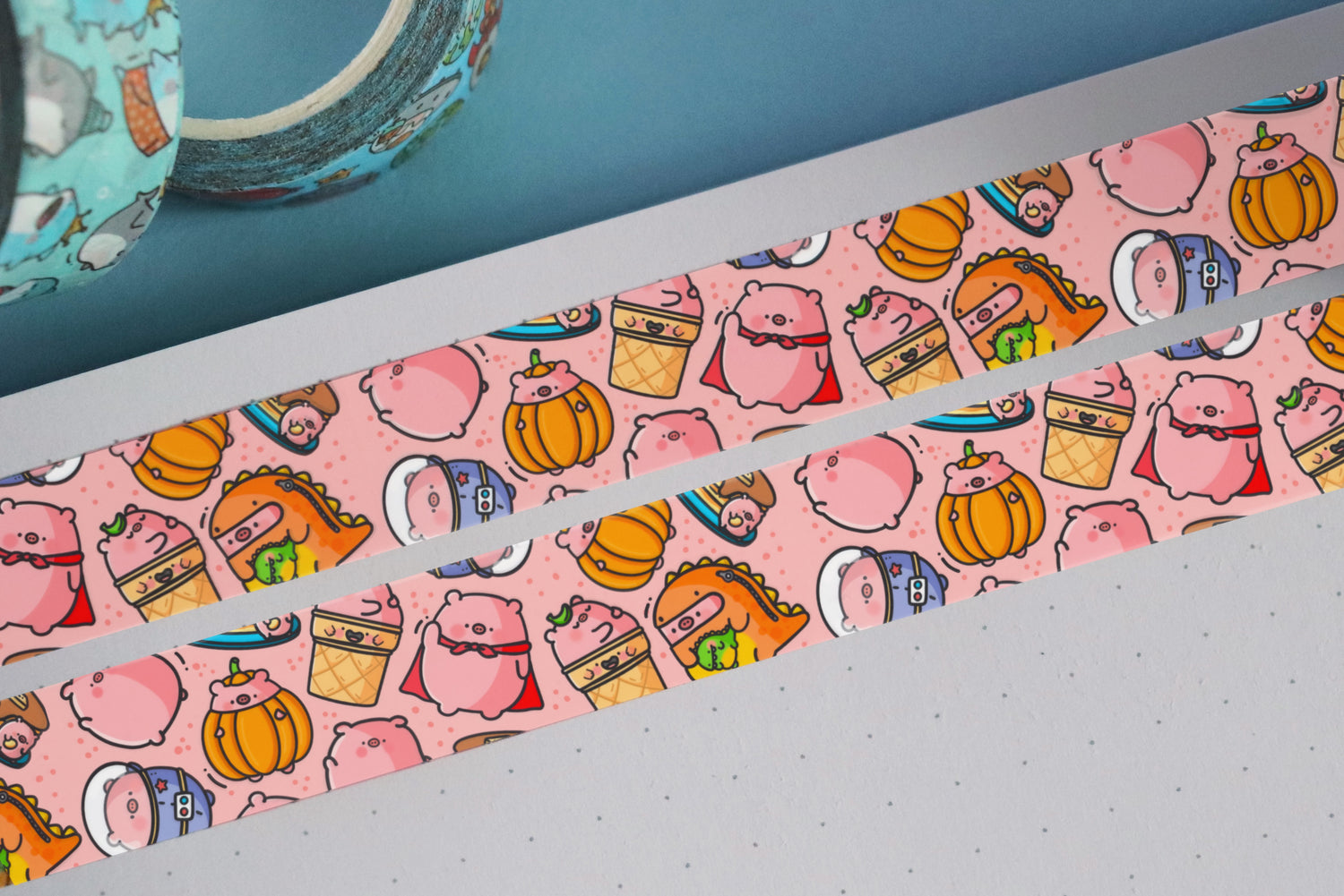 Pig washi tape on notebook and blue table
