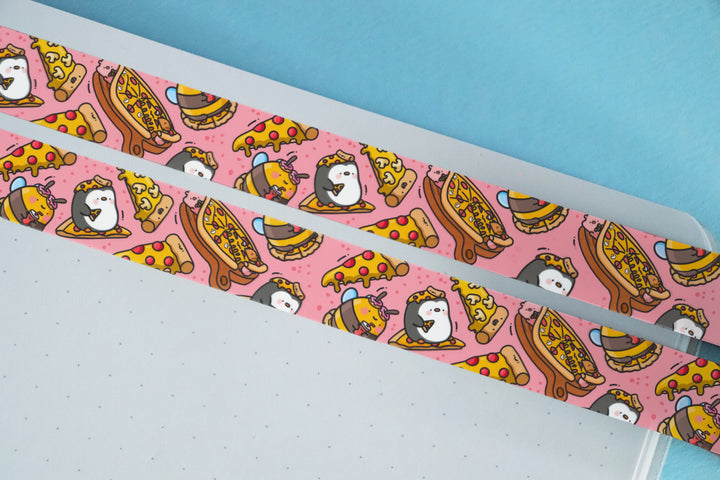 Pizza washi tape stuck on notebook and blue background