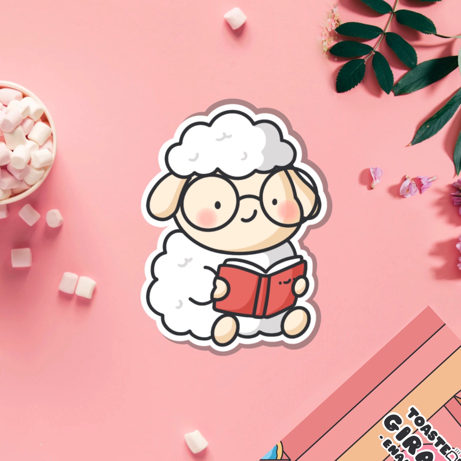 Reading sheep vinyl sticker on pink table