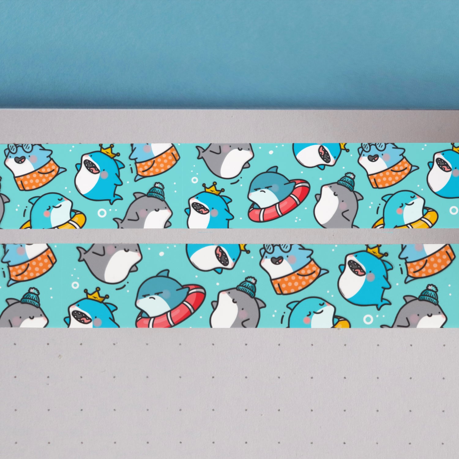 Blue shark print washi tape on notebook and blue background