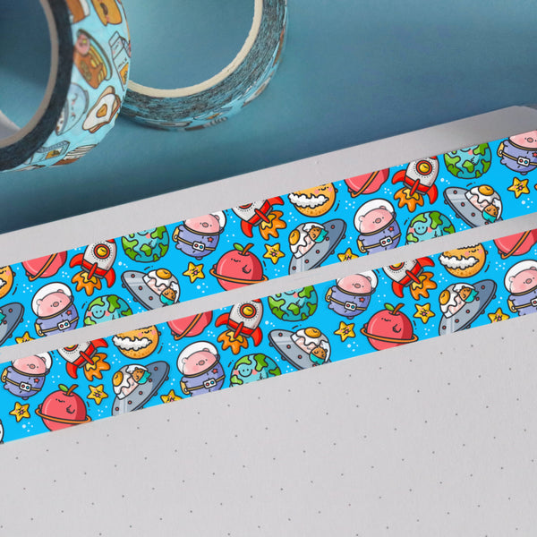 Space washi tape on blue table and notebook