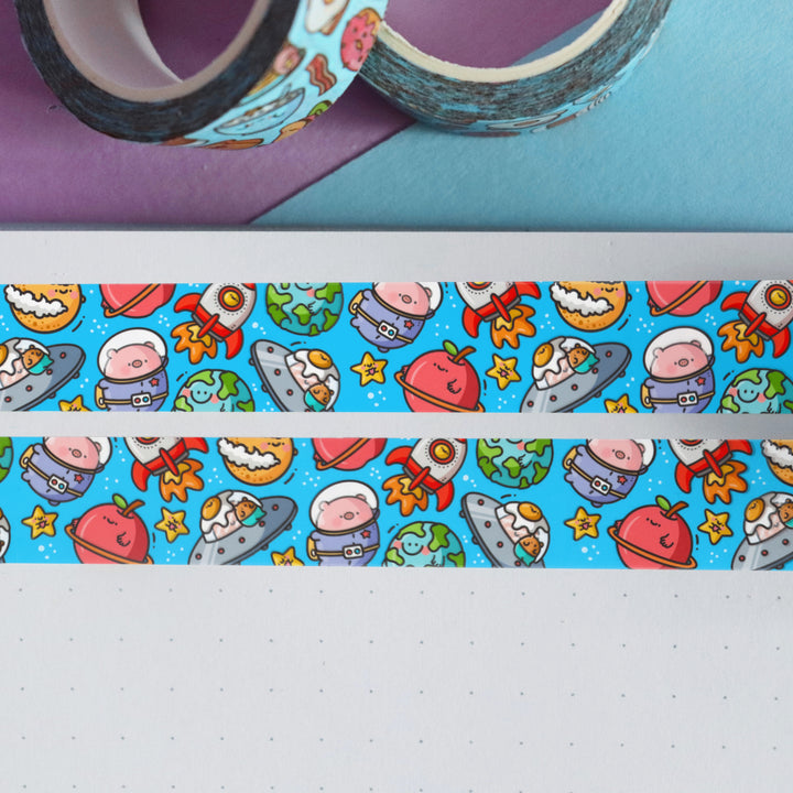 Space washi tape on table with 2 rolls of washi tape