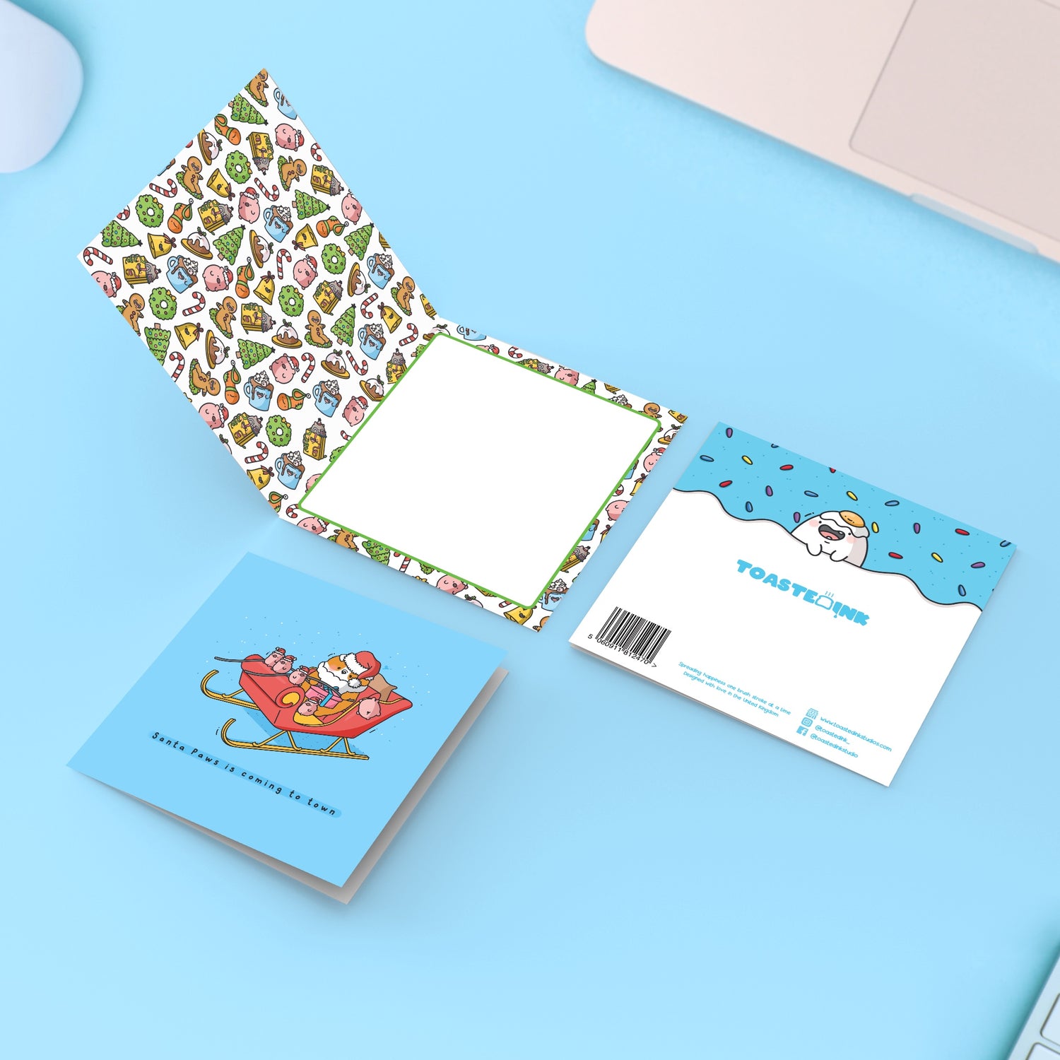 Santa Dogs Christmas card on blue table