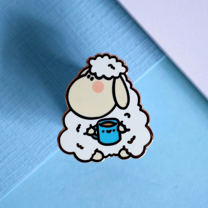 Sheep holding mug enamel pin