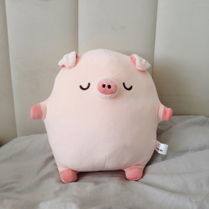Pig plush on bed