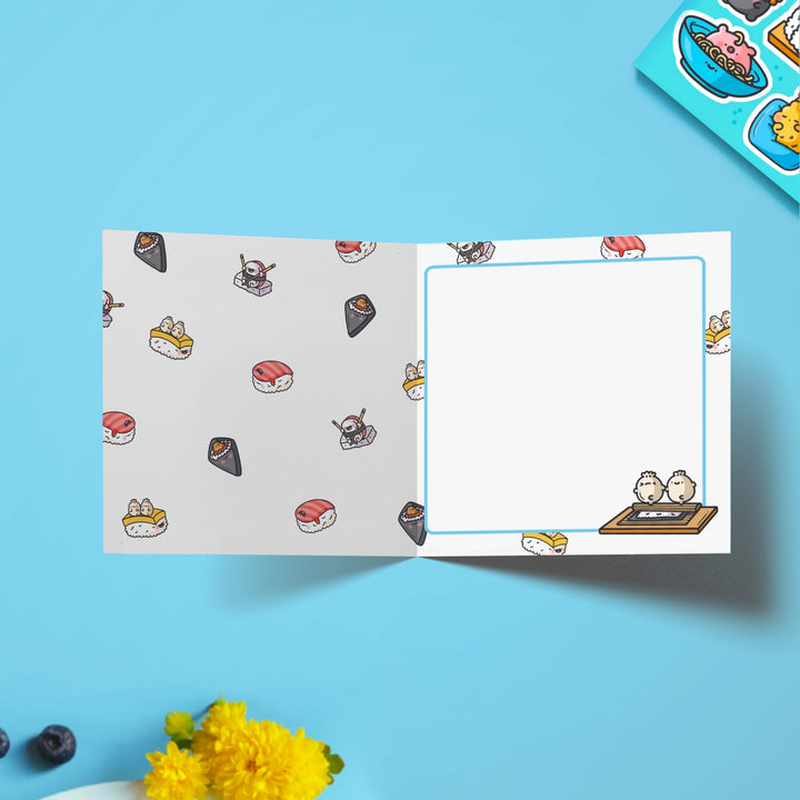 Sushi print inside the card on blue desk