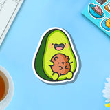 Avocado with bear vinyl sticker on blue table