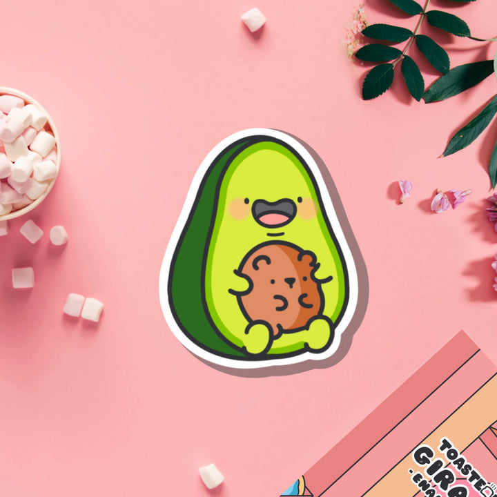 Avocado with bear vinyl sticker on pink table