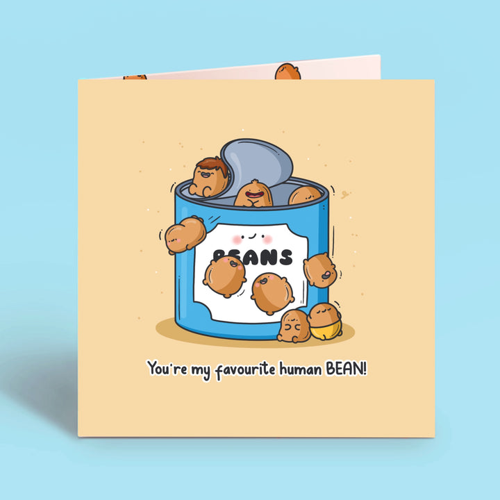 Baked beans card on blue table