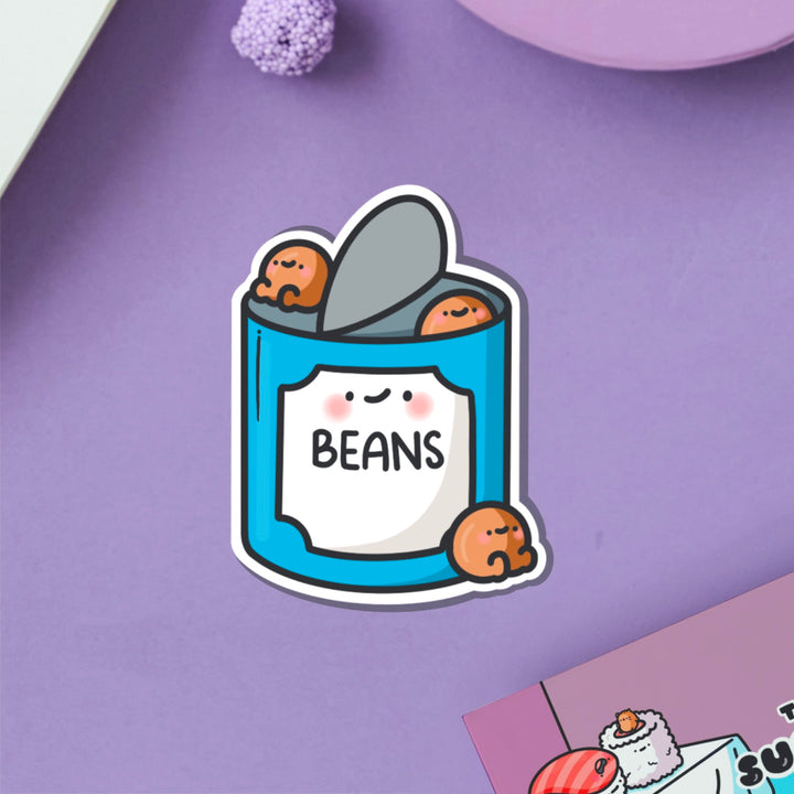 Baked beans vinyl sticker on purple table