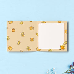 Banana print inside card on blue table