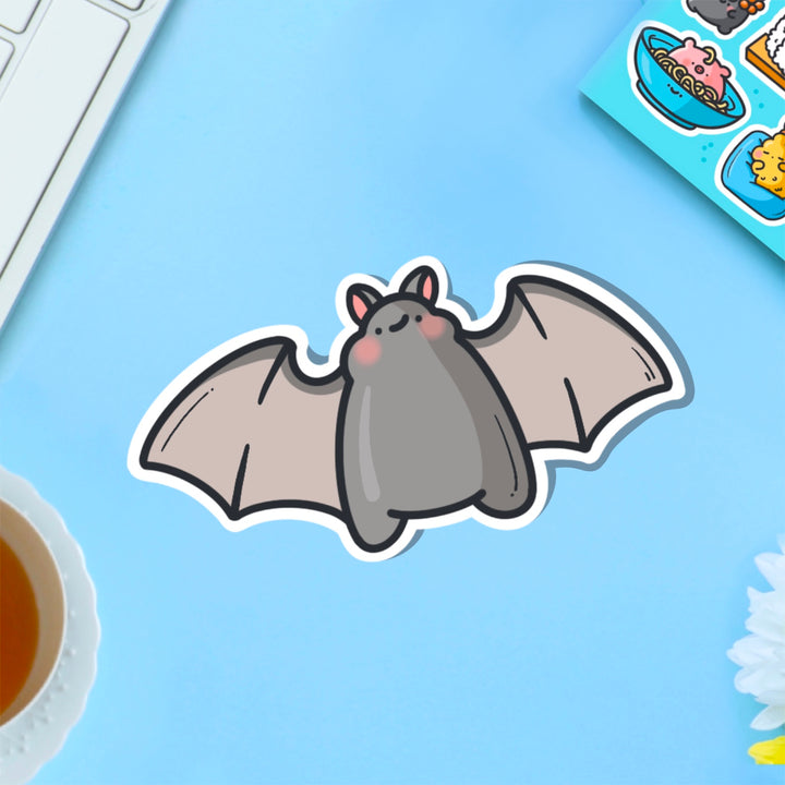 Bat vinyl sticker on blue table