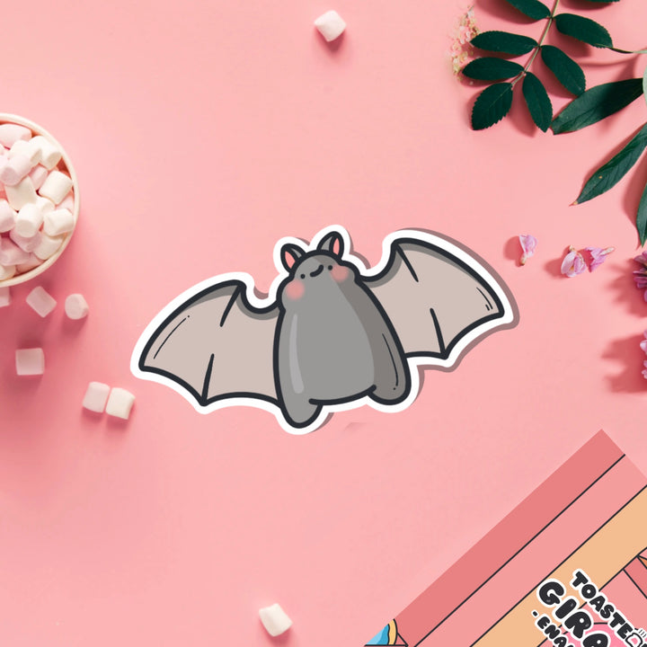 Bat vinyl sticker on pink table