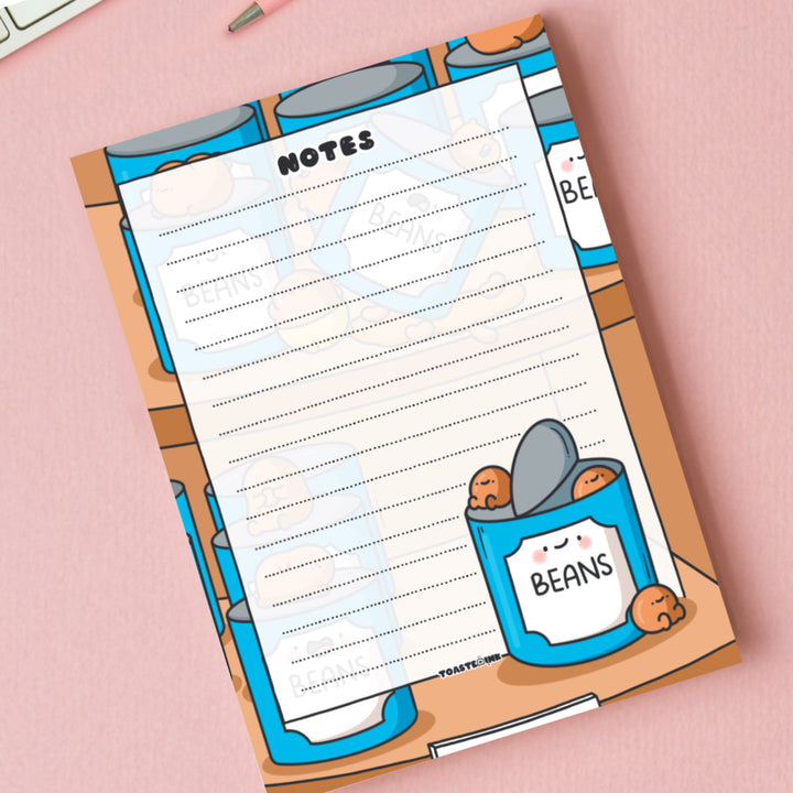 A6 Baked beans notepad on pink table