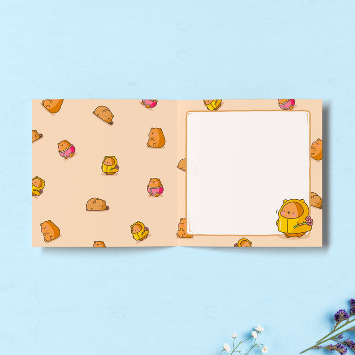 Bear print inside Toastedink greeting card on blue table