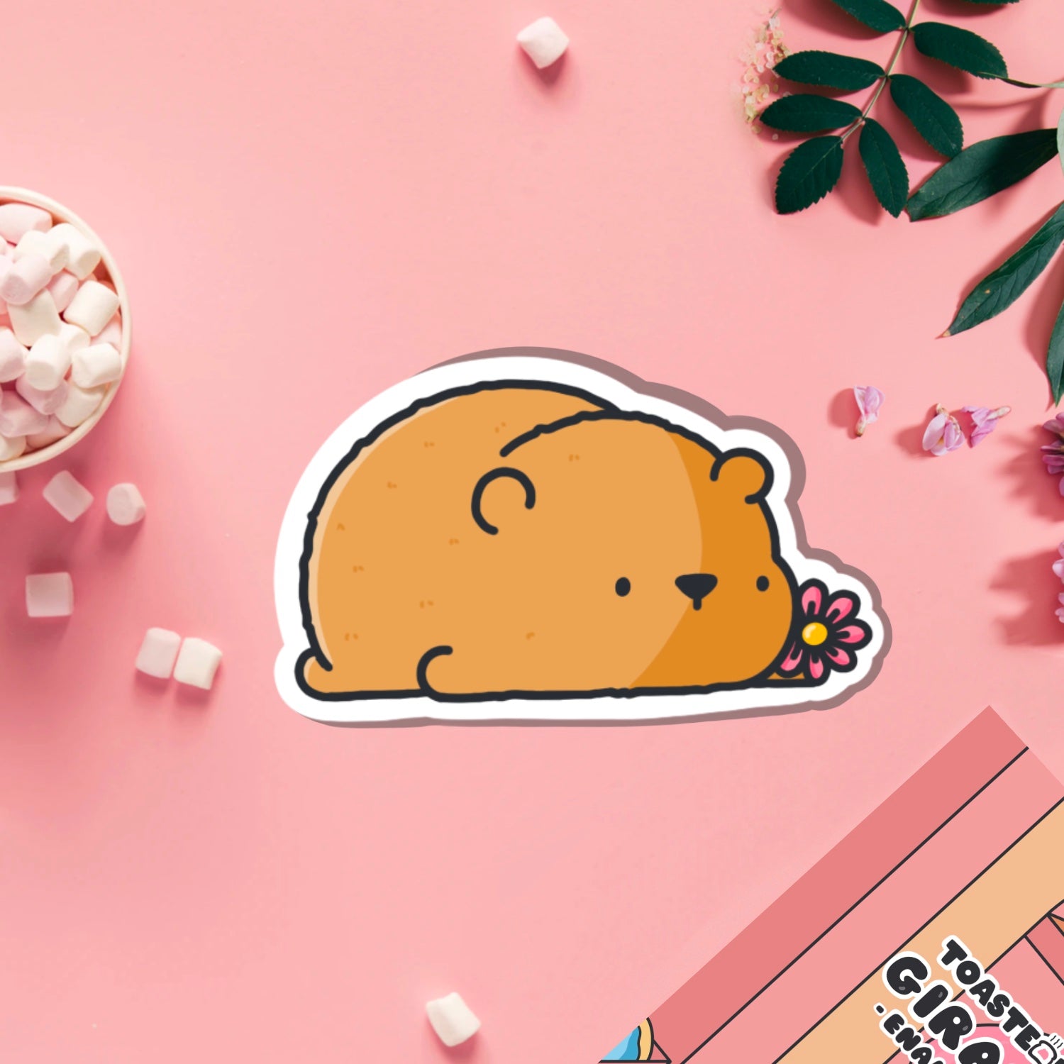 Bear with a flower vinyl sticker on pink table