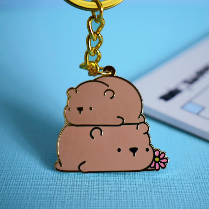 Bear keyring with notebook on table