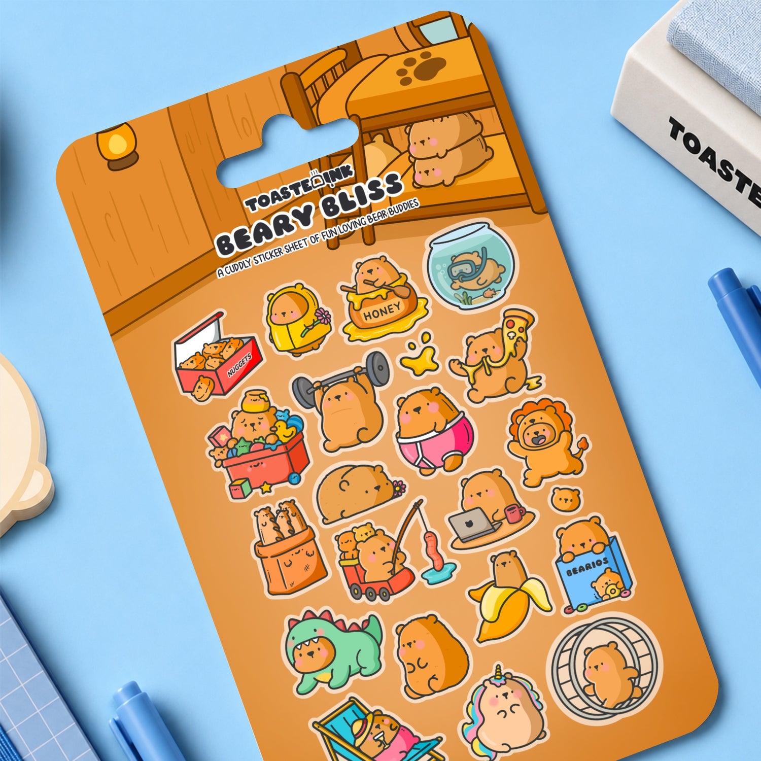 Bear sticker sheet with whimsical bear stickers on blue desk with stationery 