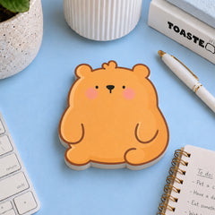 Bear shaped sticky notes on blue desk with stationery