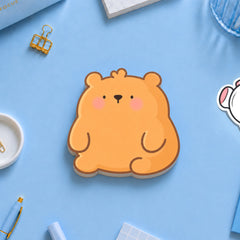 Bear shaped sticky notes on blue table with stationery 