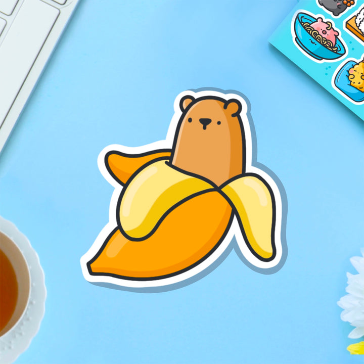 Bear banana vinyl sticker on blue table