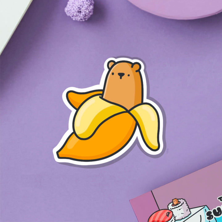 Bear banana vinyl sticker on purple table