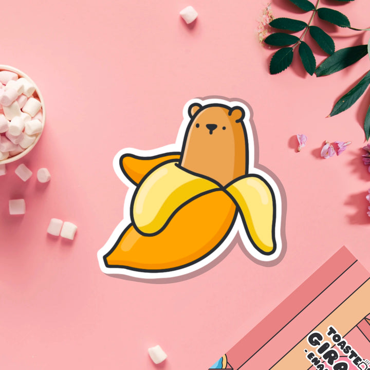 Bear banana vinyl sticker on pink table