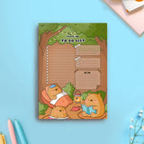 Bear to do list notepad on blue table flat lay with pens and notebooks
