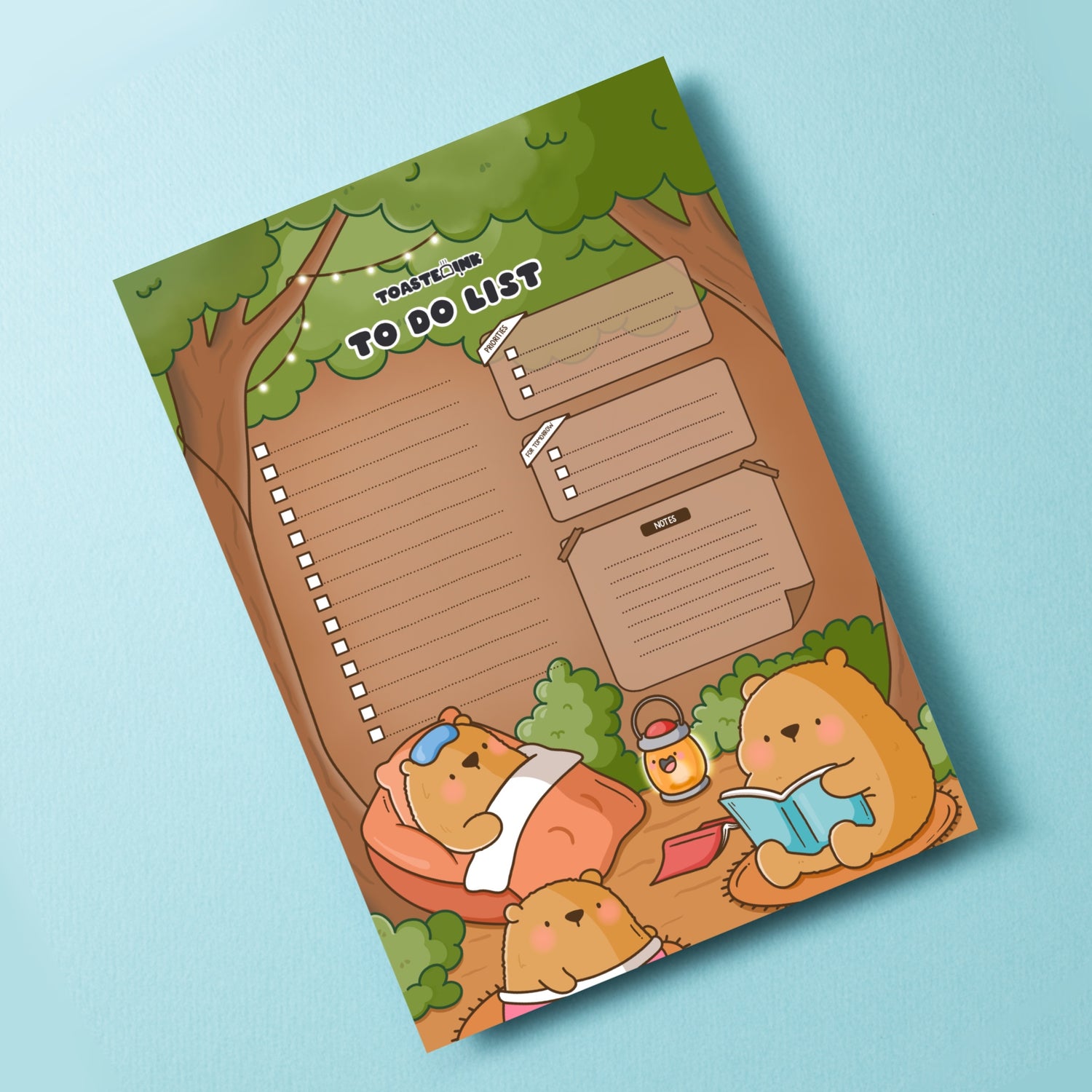 Woodland bears to do list notepad on blue desk