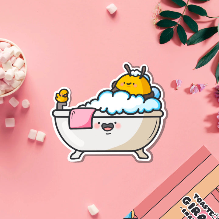 Bee in a bathtub vinyl sticker on pink table