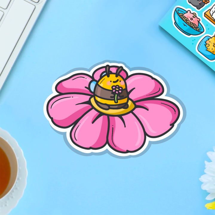 Bee on a flower vinyl sticker on blue table