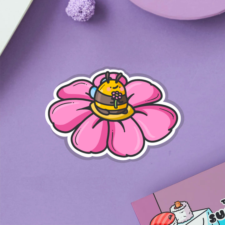 Bee on a flower vinyl sticker on purple table