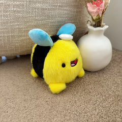 Bee plush keychain on carpet
