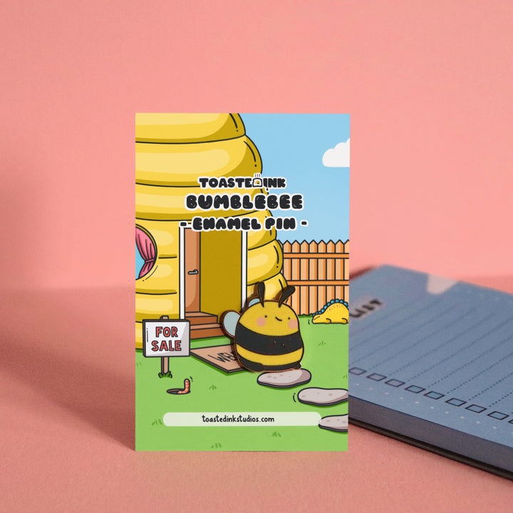 Bee enamel pin on beehive house backing card