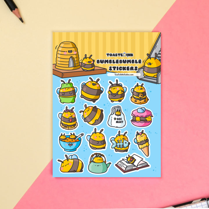 Bee sticker sheet on yellow and pink table